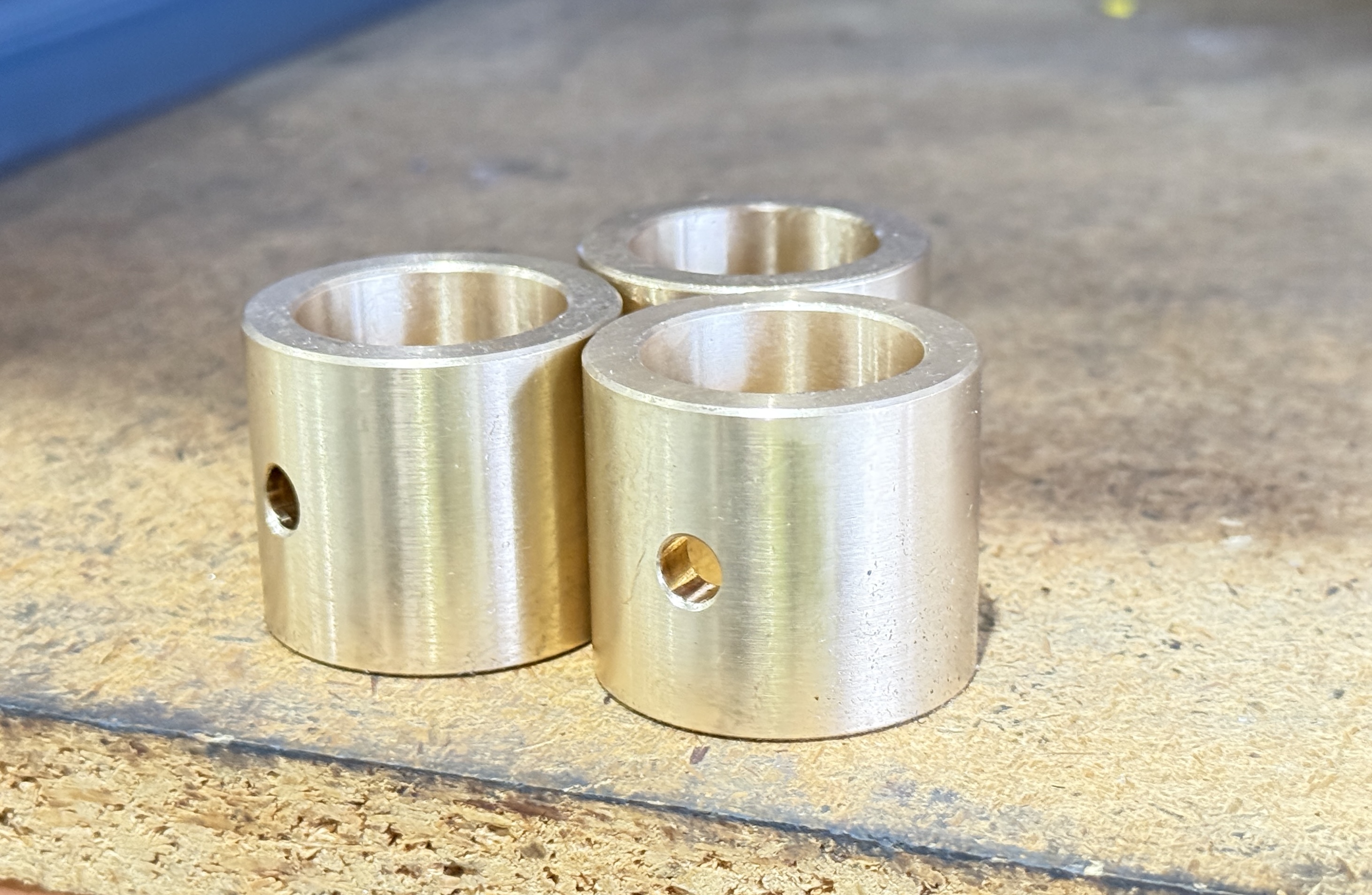 Set of brass bushings — active production work at the Malaga workshop
