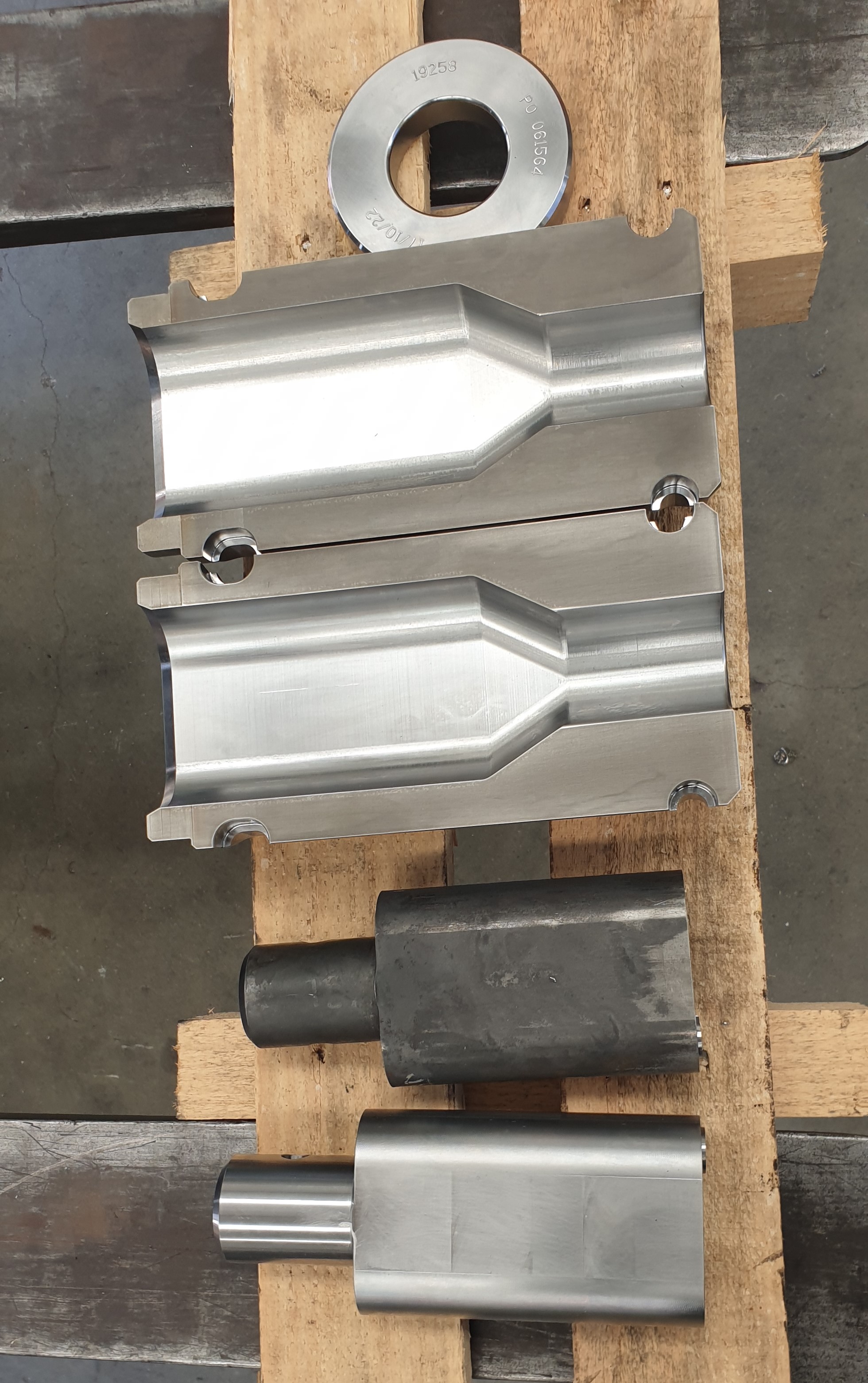 Two-cavity forging die set — upper and lower halves machined in tool steel