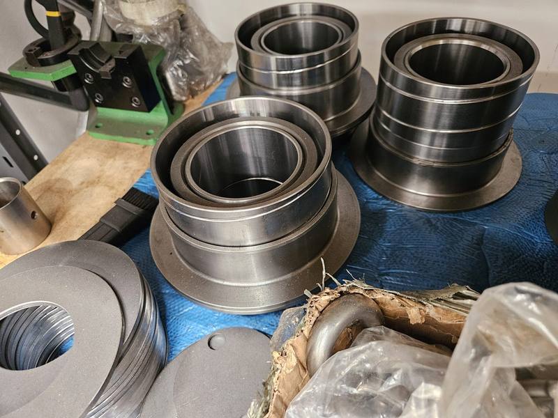 Top-hat bushings — flanged trailer wear parts machined at the Malaga workshop