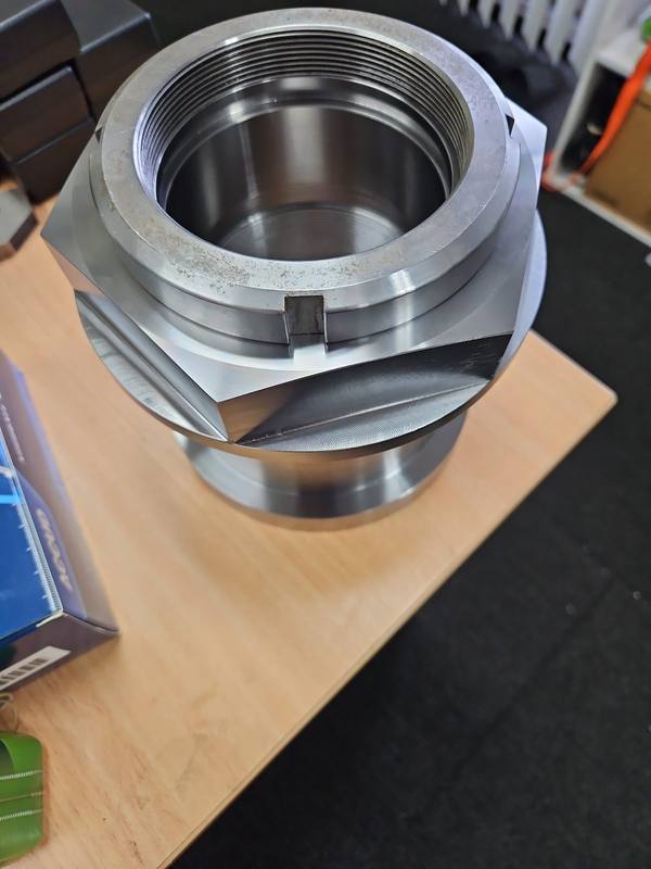 Hex-bodied stainless housing assembly with internal trim